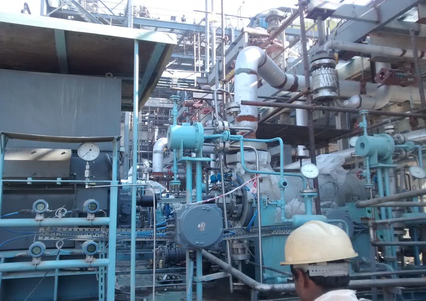 Field engineer commissioning a pump train in-plant